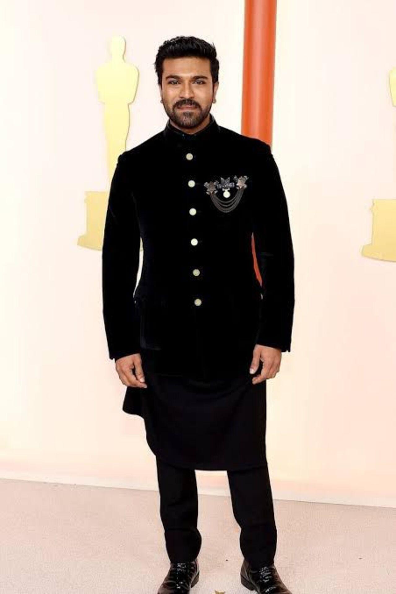 Ram Charan made heads turn on a global stage at the Academy Awards in a custom black bandhgala blending Indian craftsmanship with modern tailoring.